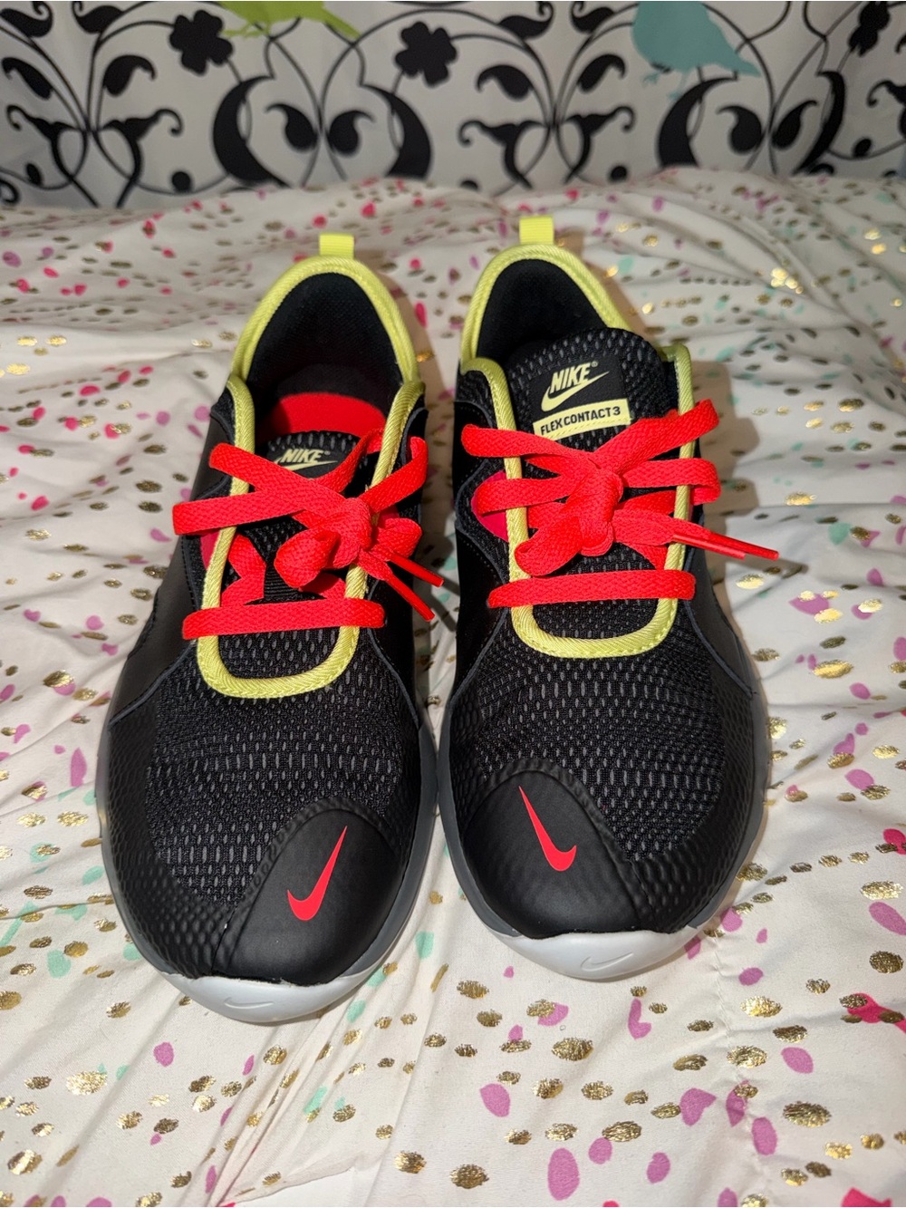 Nike Kids Black Sneakers with Neon Yellow Trim and Red Laces